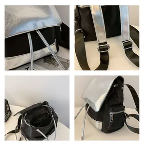 Detail view of large capacity colorblock backpack with silver flap and drawstring closure