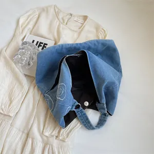 Blue denim tote bag with white rose embroidery for casual daily school and commute