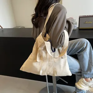 Chic cream canvas tote bag with 3D pleats and navy blue handles for women