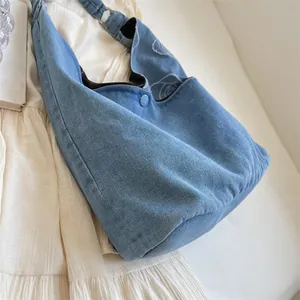 Light blue denim crescent tote bag with spacious interior for casual daily use