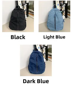 Vue détaillée des sacs à dos en jean grande capacité en noir, bleu clair et bleu foncé
