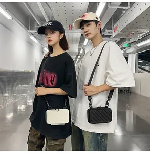 Dual-color hard shell crossbody bags with textured stripes and black nylon straps