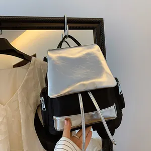 Large capacity contrast color backpack with silver metallic flap and nylon fabric