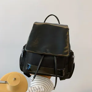 Large capacity color-block black backpack with nylon stitching and drawstring flap cover