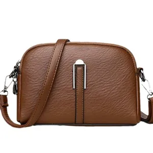 Dark brown faux leather crossbody shell bag with litchi texture and silver hardware