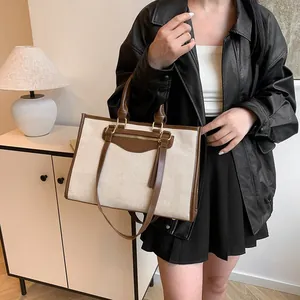 Retro linen tote bag with contrast leather trim and external pocket for daily commute