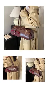 Detail showing the burgundy leather texture and metal buckle accents on the shoulder bag
