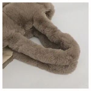 Close-up of taupe faux fur tote bag showing plush texture and light beige leather lining