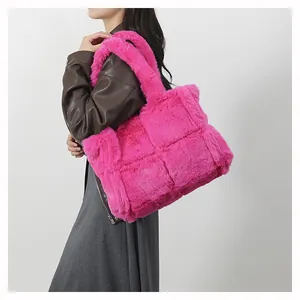 Detail shot of hot pink plush tote bag showing woven faux fur texture and large capacity