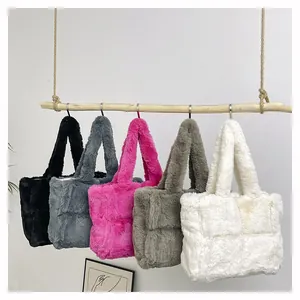 Faux fur quilted tote bags shown in five colors hanging on wooden beams with metal hooks