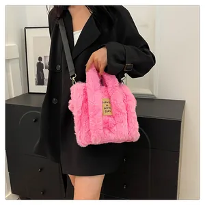 Detail of pink faux fur tote bag with Have a Nice Day patch and adjustable strap