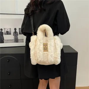 Plush faux fur tote bag in creamy white with adjustable shoulder strap for autumn/winter