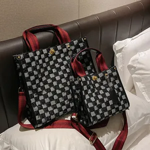 Large checkered denim tote bag with red handles and matching mini pouch set