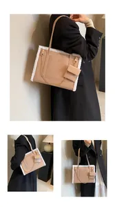 Detail of apricot lamb-fleece tote bag with gold chain and matching mini pouch accessory