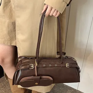 Deep coffee vintage baguette bag with buckle strap and mini pouch on shoulder