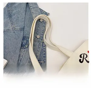 Close-up of durable canvas tote strap with clean stitching and premium fabric texture