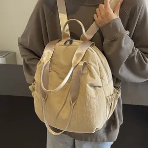 Large khaki nylon travel backpack with versatile shoulder straps for daily commuting