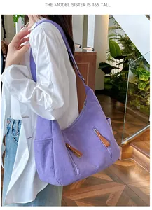 Detail view of purple corduroy dumpling bag showing side pockets and thick texture on a 165cm model