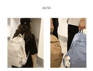 Minimalist waterproof nylon backpack with cute duck charm shown in multiple colors