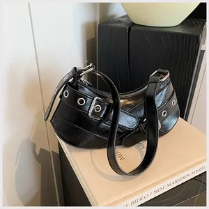 Detailed macro shot showing glossy black PU leather texture and silver metal eyelets