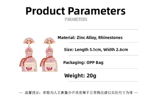 Detail showing gold tequila bottle earrings with pink rhinestones and dimensions