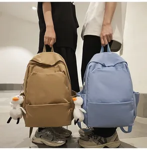 Waterproof nylon backpacks in khaki and sky blue colors with cute duck charms
