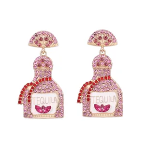 Fashionable tequila bottle earrings with pink rhinestones and gold-plated finish