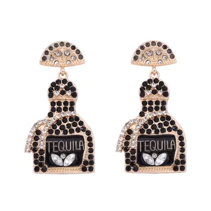 Detail showing Tequila bottle earrings with gold plating and sparkling rhinestones
