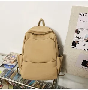 Minimalist khaki waterproof backpack featuring spacious front pocket and side bottle holders