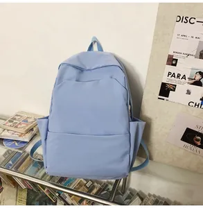 Detailed view of large capacity waterproof light blue backpack with front zip pocket