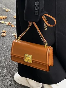 Chic square PU leather shoulder bag in caramel brown with elegant gold geometric twist lock