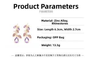 Detailed view of branch-shaped earrings with purple crystals and 6.3cm size markers
