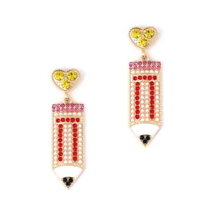 Creative crystal pencil drop earrings with heart studs and red stripes on white background