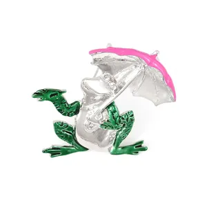 Charmante Brosche mit Frosch und rosa Schirm aus grünem Emaille und poliertem Silber