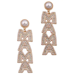 Macro detail of MAMA drop earrings featuring gold plating and crystal pavé letters