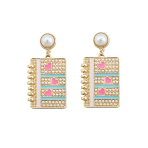 Creative notebook drop earrings with pink enamel hearts and white faux pearls