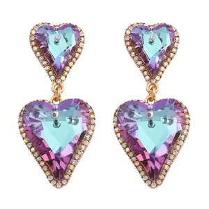 Elegant gold heart earrings with gradient purple crystals and sparkling rhinestone borders