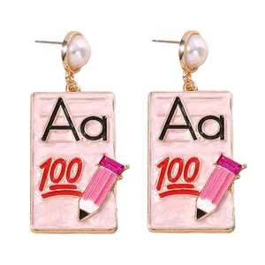 Fashionable pencil and school theme earrings with pearl accent and pink enamel finish