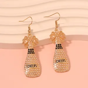 Champagne bottle earrings with pearls and black rhinestones featuring Cheers text