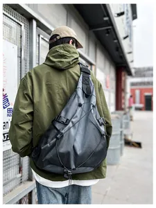 Men's large crossbody bag with side mesh pocket and front bungee cord detail