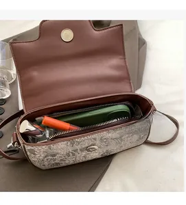 Detailed interior of vintage crossbody bag showing ample space for daily essentials