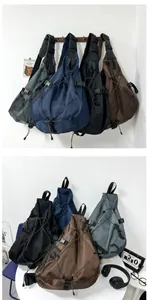 Detail view of tactical crossbody bags in black, blue, green and brown nylon fabric