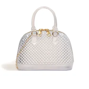 Transparent jelly shell bag with studded texture and gold chain strap for women