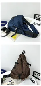 Detail of crossbody bag showing ripstop nylon texture, elastic cords, and plastic buckles