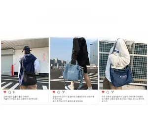 Detail view of large denim tote bag featuring retro letter print and spacious interior