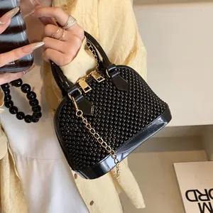 Fashionable black beaded shell crossbody bag with golden chain strap for women