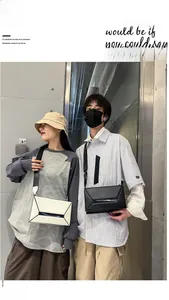 Modern geometric folding crossbody bags in black and cream with wide nylon straps