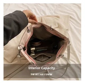 Macro view of large laser tote bag interior with spacious compartment and zipper pocket