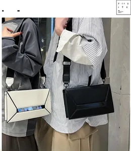 Detail of crossbody bag with geometric design and clear window for smartphone screen