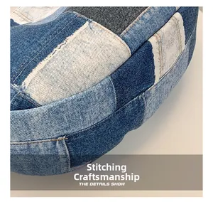Close-up of stitching craft on multi-tone denim patchwork canvas shoulder bag